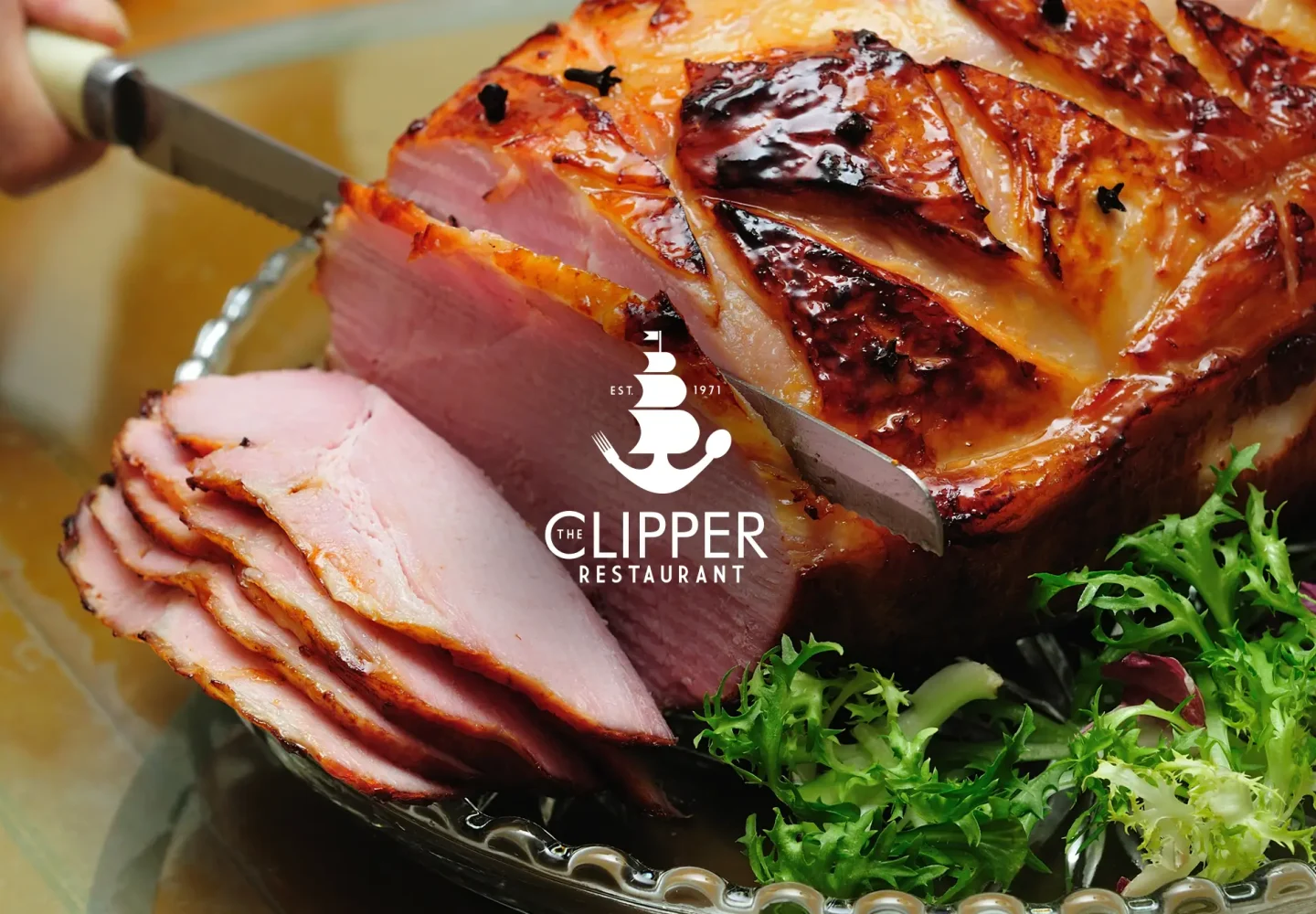 Slicing a smoked baked ham at the Clipper Restaurant.